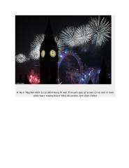 Đồng hồ Big Ben điểm 12 giờ đêm trong thời khắc chuyển giao giữa năm cũ và năm mới khi pháo hoa rực sáng bầu trời thủ đô London(1).doc